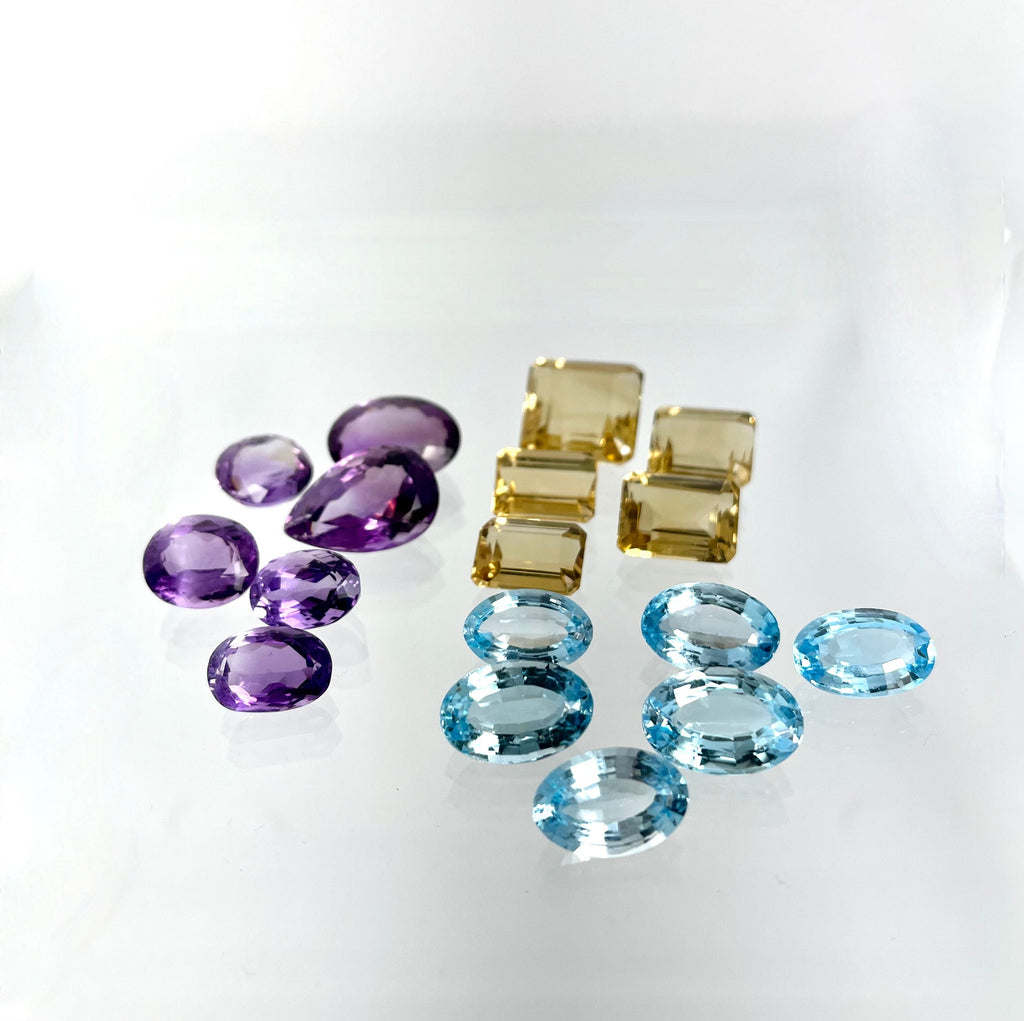 Loose Gemstone Lot: Amethyst (February Birthstone), Blue Topaz and Citrine (both November Birthstones) totalling 301.40 Carats