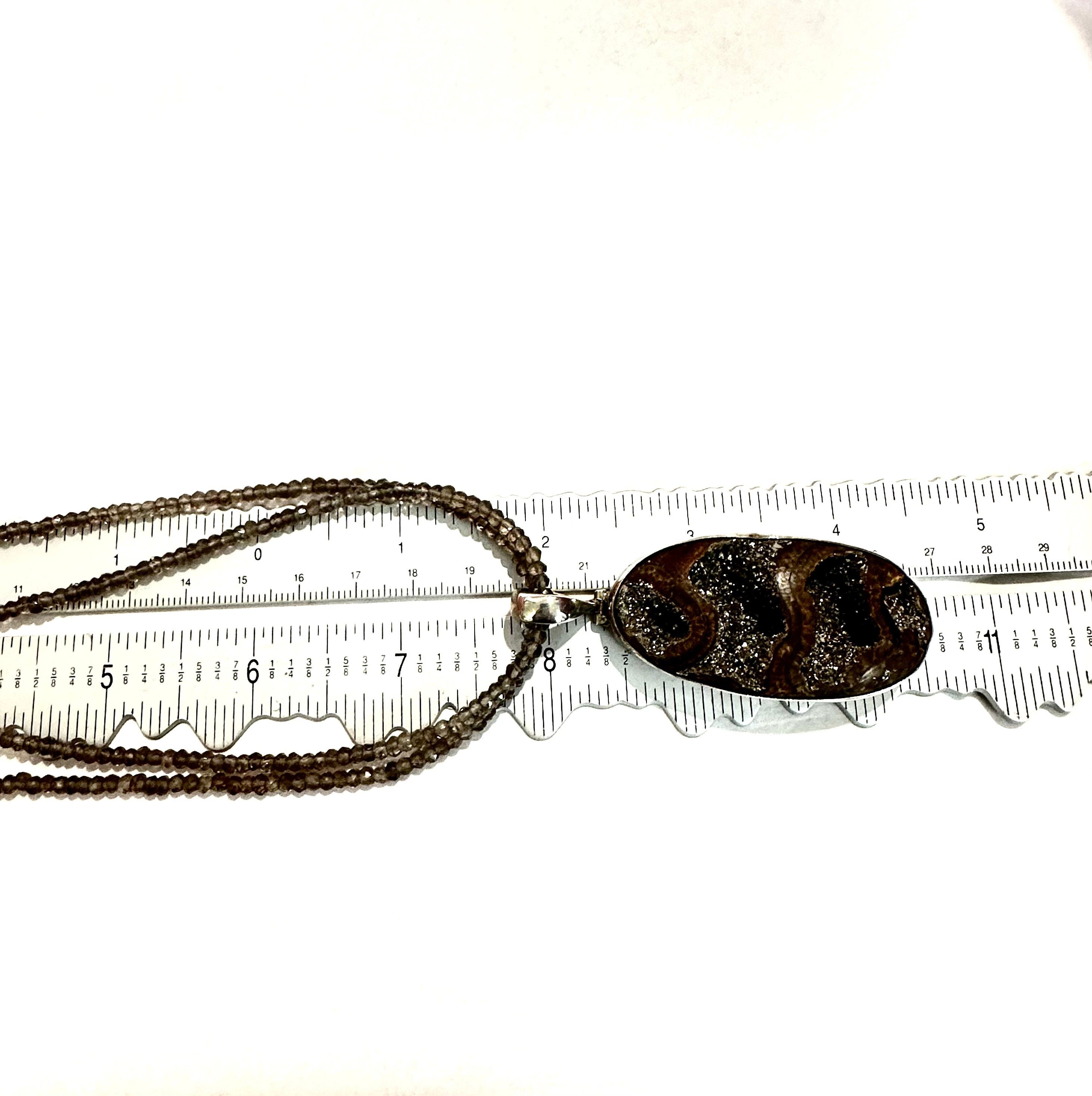 Large Ammonite set in Sterling Silver Frame,  Supported by a Smokey Quartz Necklace