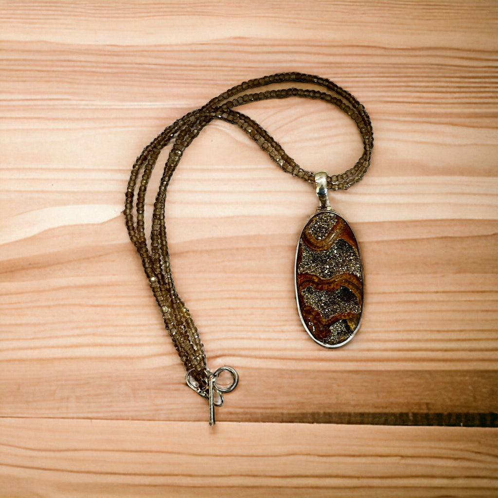 Large Ammonite set in Sterling Silver Frame,  Supported by a Smokey Quartz Necklace