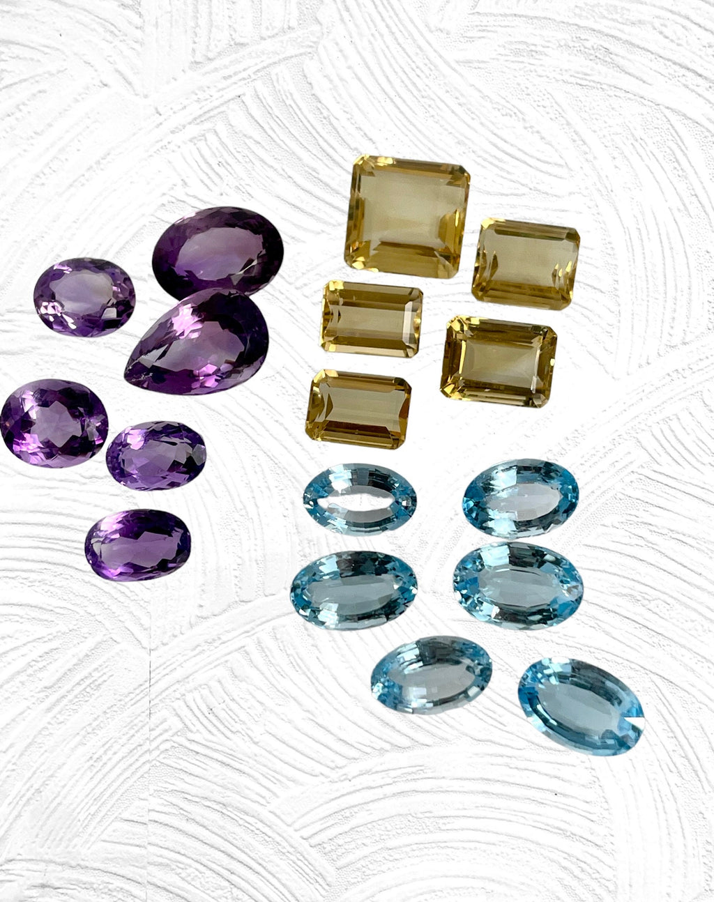 Loose Gemstone Lot: Amethyst (February Birthstone), Blue Topaz and Citrine (both November Birthstones) totalling 301.40 Carats