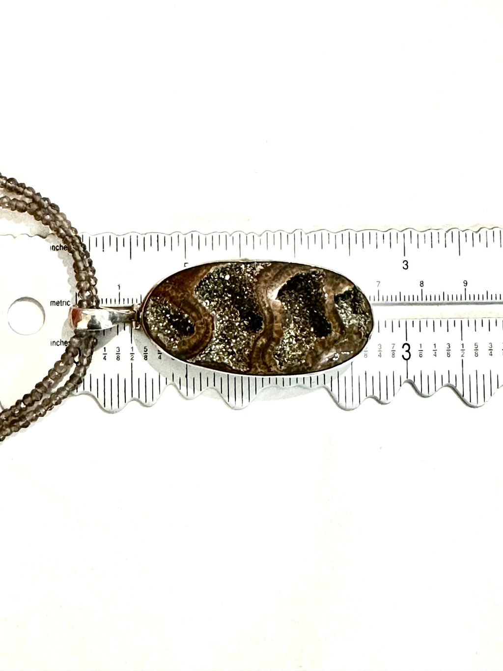 Large Ammonite set in Sterling Silver Frame,  Supported by a Smokey Quartz Necklace