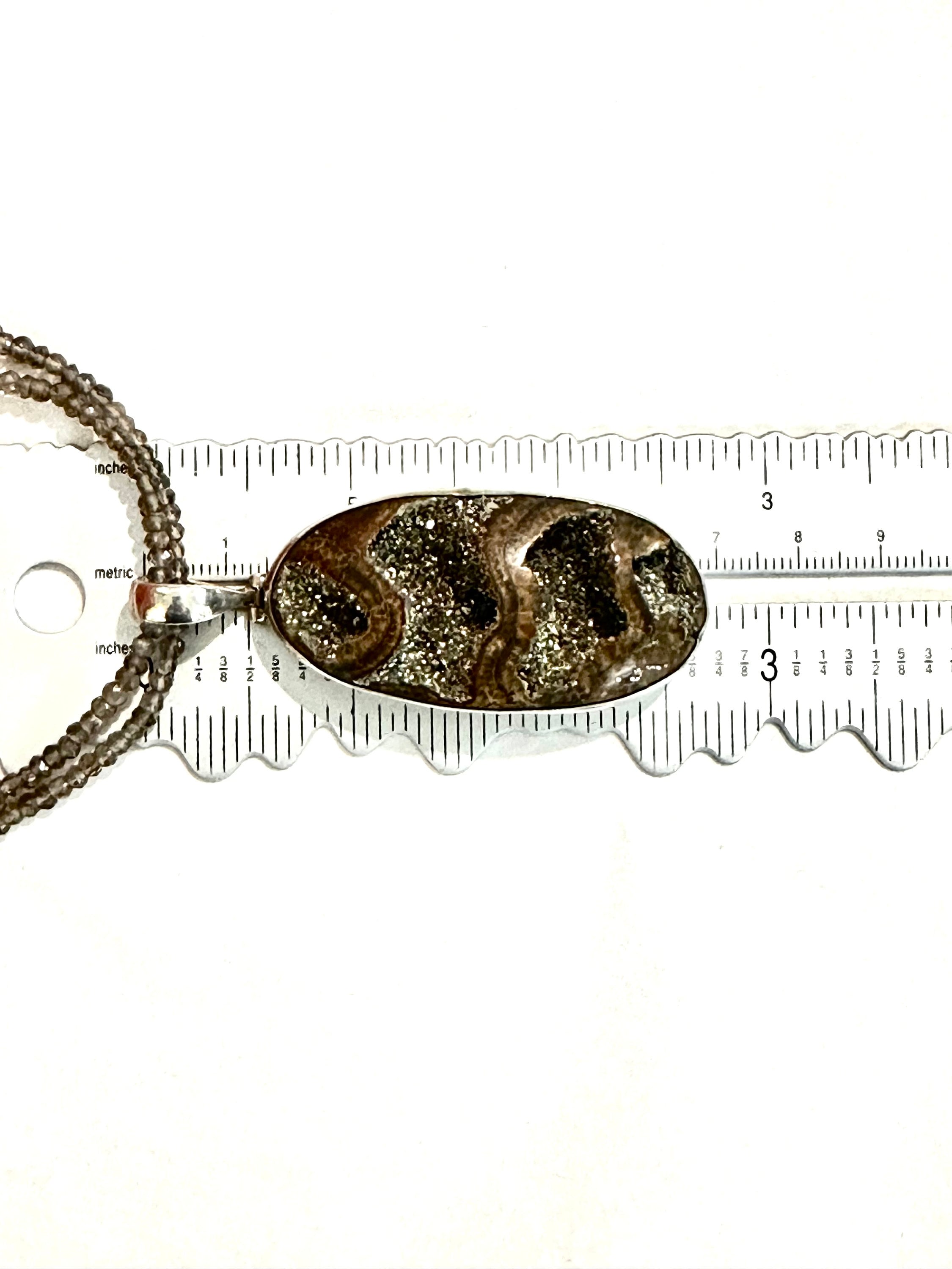 Large Ammonite set in Sterling Silver Frame,  Supported by a Smokey Quartz Necklace