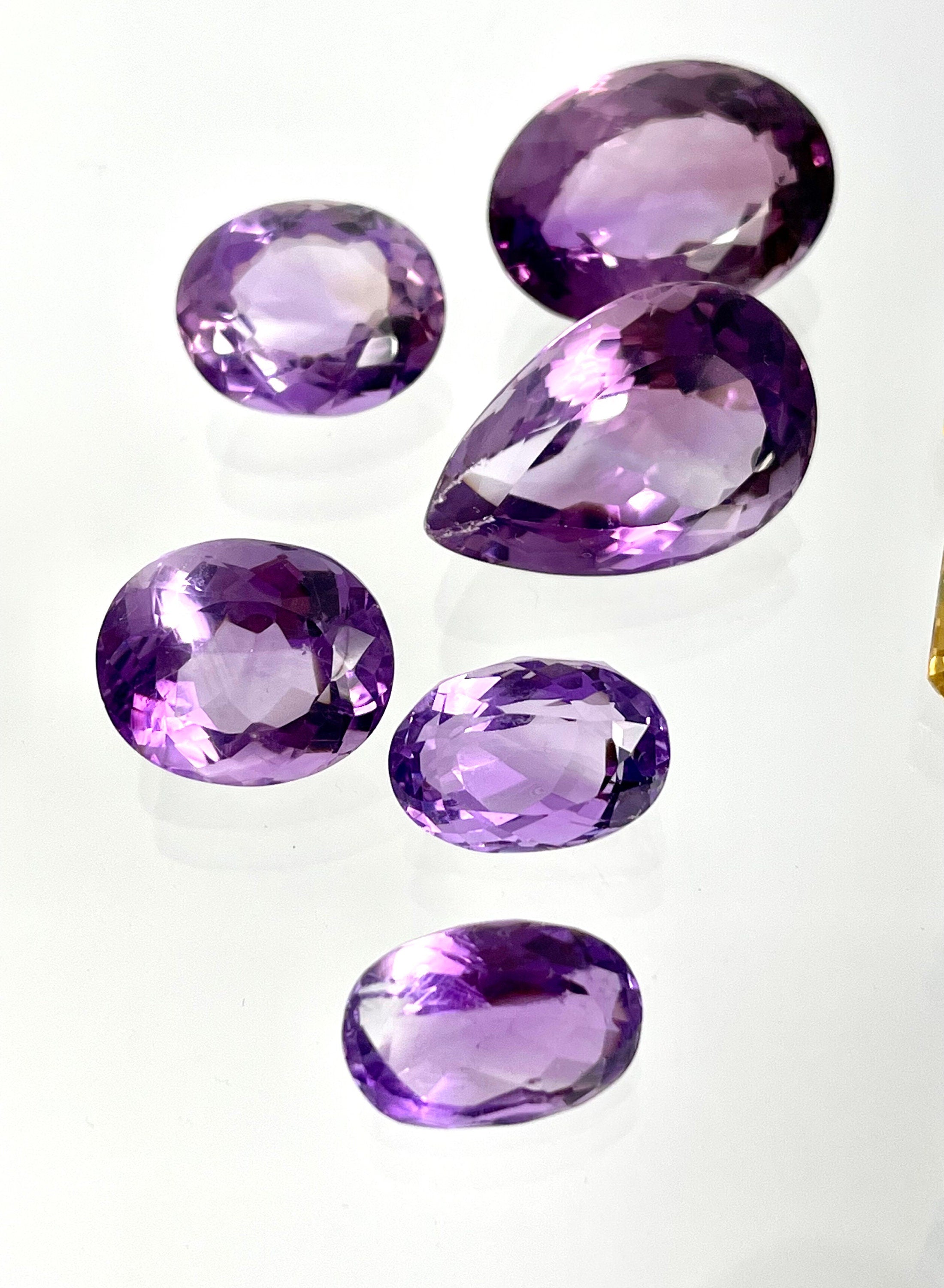 Loose Gemstone Lot: Amethyst (February Birthstone), Blue Topaz and Citrine (both November Birthstones) totalling 301.40 Carats