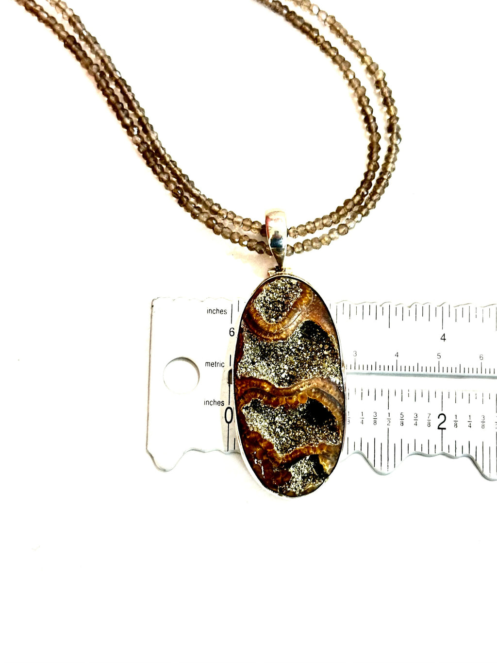 Large Ammonite set in Sterling Silver Frame,  Supported by a Smokey Quartz Necklace