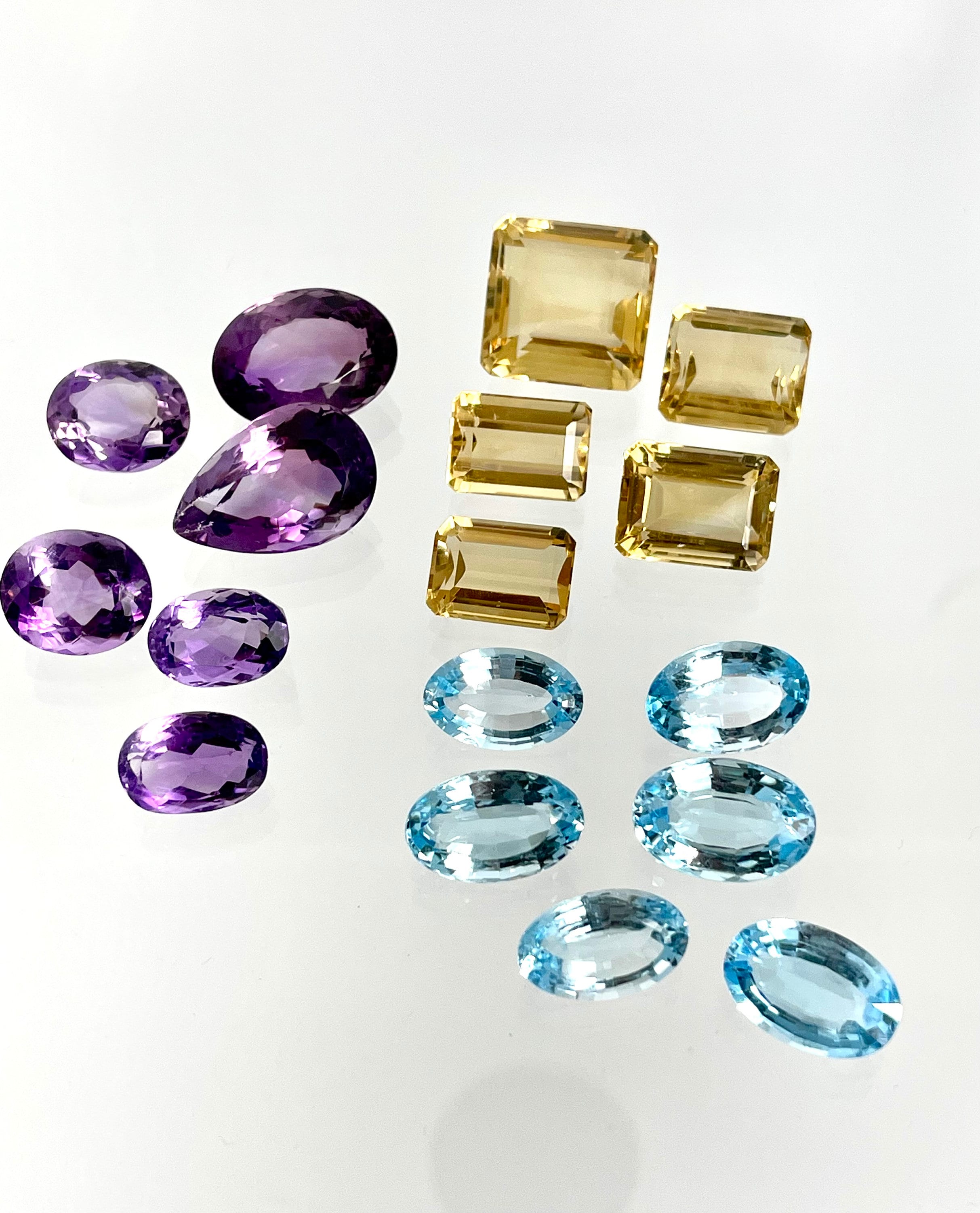 Loose Gemstone Lot: Amethyst (February Birthstone), Blue Topaz and Citrine (both November Birthstones) totalling 301.40 Carats