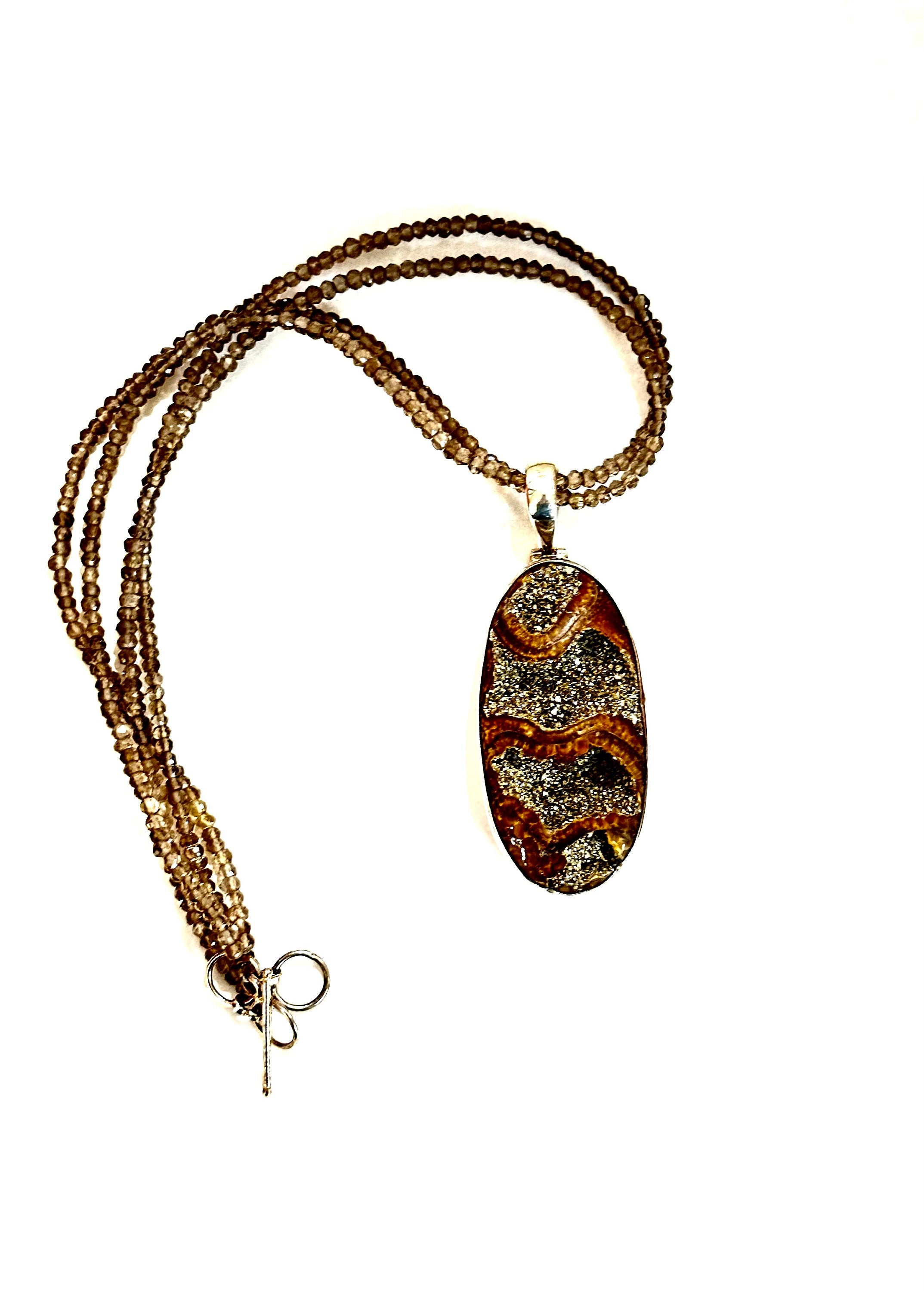 Large Ammonite set in Sterling Silver Frame,  Supported by a Smokey Quartz Necklace