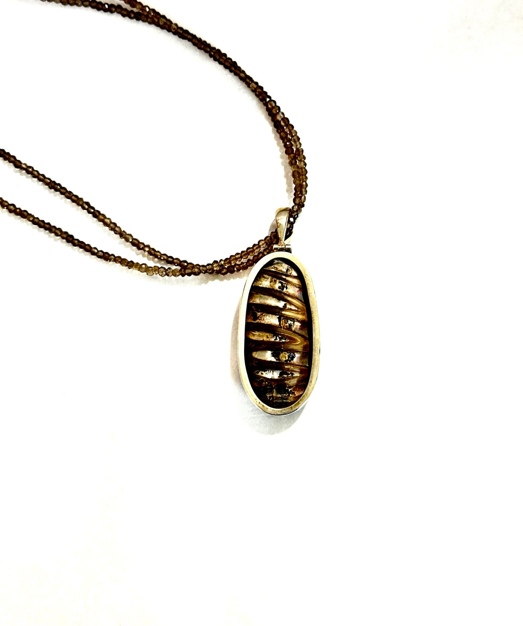 Large Ammonite set in Sterling Silver Frame,  Supported by a Smokey Quartz Necklace