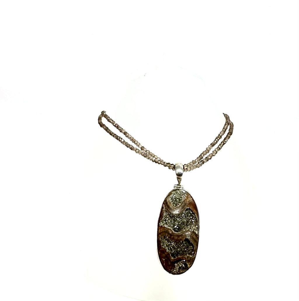 Large Ammonite set in Sterling Silver Frame,  Supported by a Smokey Quartz Necklace