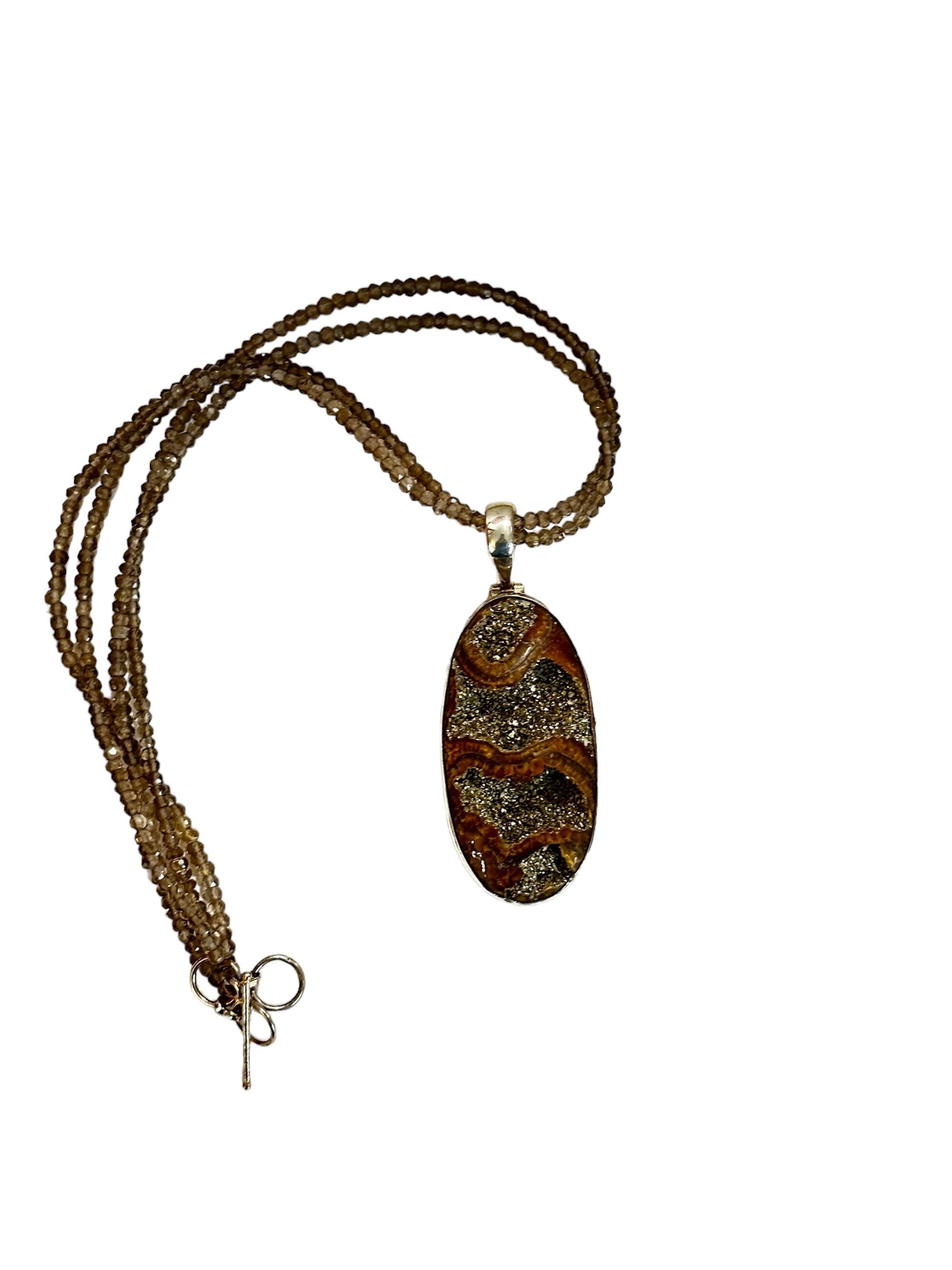 Large Ammonite set in Sterling Silver Frame,  Supported by a Smokey Quartz Necklace